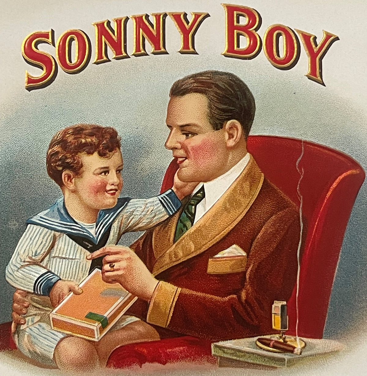 Vintage "Sonny Boy" cigar label featuring a man in a red jacket giving a book to a young boy in a sailor outfit, with gold le