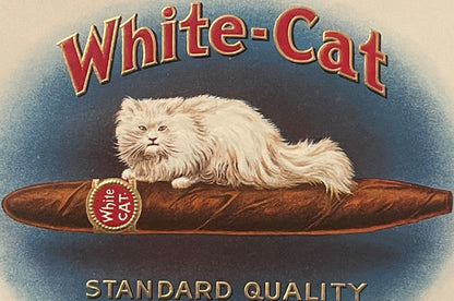 Antique White-Cat cigar box label with gold embossed text, white fluffy cat on brown cigar, blue background, "Standard Qualit