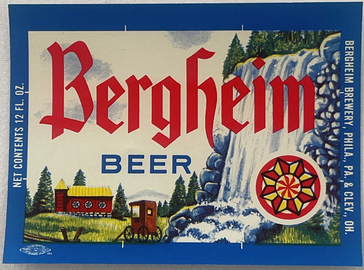 Vintage Bergheim Beer label with red gothic lettering, waterfall and cabin imagery, red circular emblem, blue border