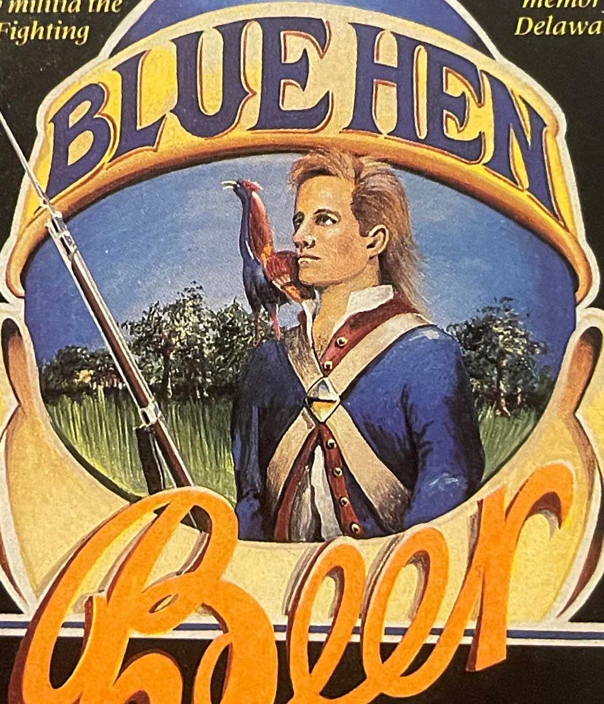 Vintage Blue Hen beer label featuring a Revolutionary War soldier in blue uniform holding a flag, with yellow and purple text