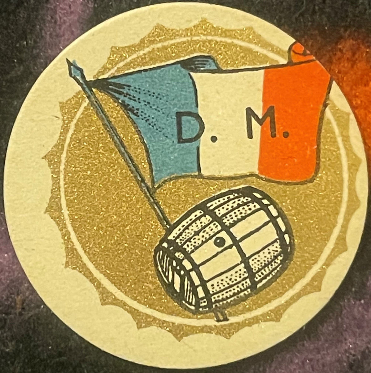 Circular French wine barrel label with gold textured background, blue and orange tricolor flag, wooden barrel illustration, a