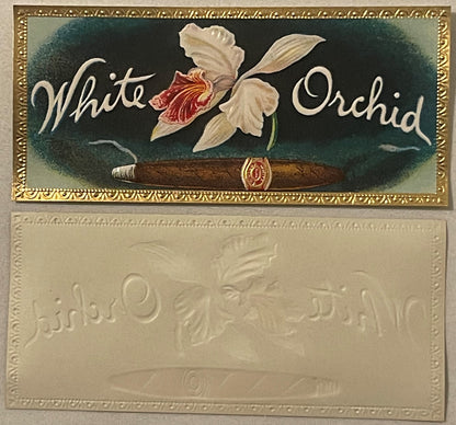 Antique cigar box label with white orchid flower and cigar illustration, embossed gold border, cream and dark green backgroun