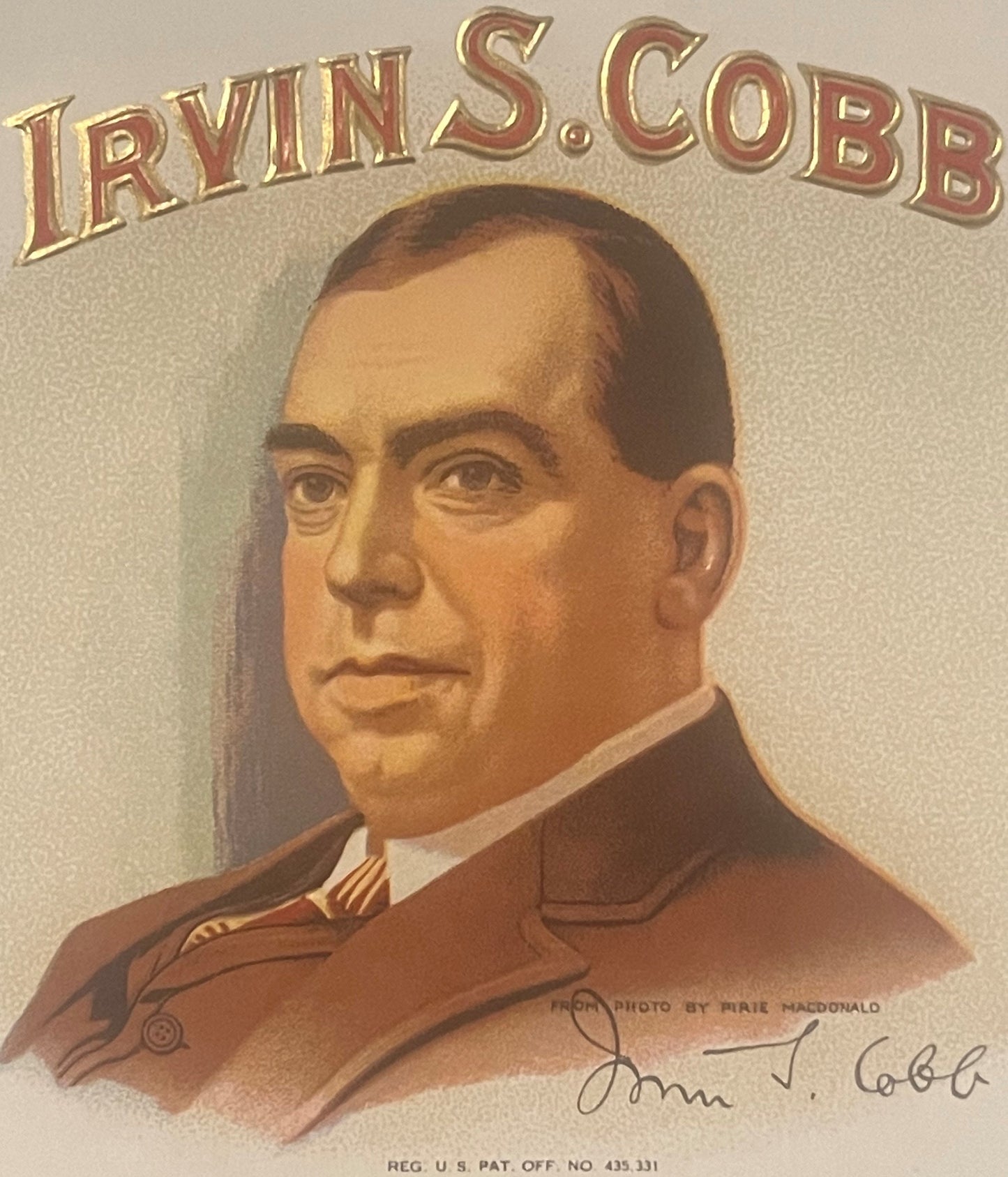 Antique embossed cigar label featuring a man's portrait in brown suit with "Irvin S. Cobb" text above and handwritten signatu
