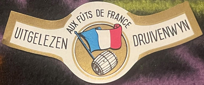 Antique wine bottle neck label with French flag, barrel illustration, and text reading "Uitgelezen Druivenwyn Aux Fûts de Fra