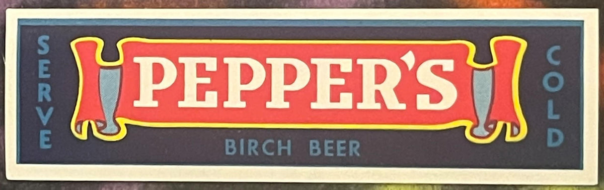 Vintage Pepper's Birch Beer bottle label with red banner and navy blue background, reading "Served Cold" on sides.