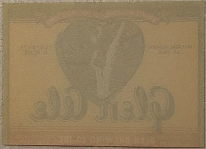 Reverse side of vintage Glen Ale beer label showing faint embossed eagle design on tan paper background