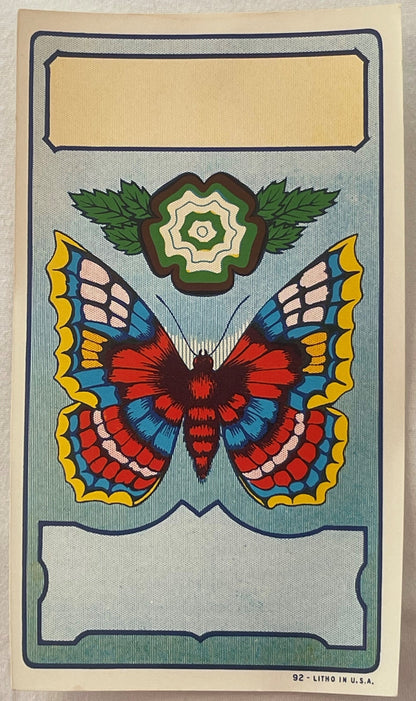 Antique lithograph broom label featuring a colorful butterfly with red, blue, and yellow patterned wings above a green flower