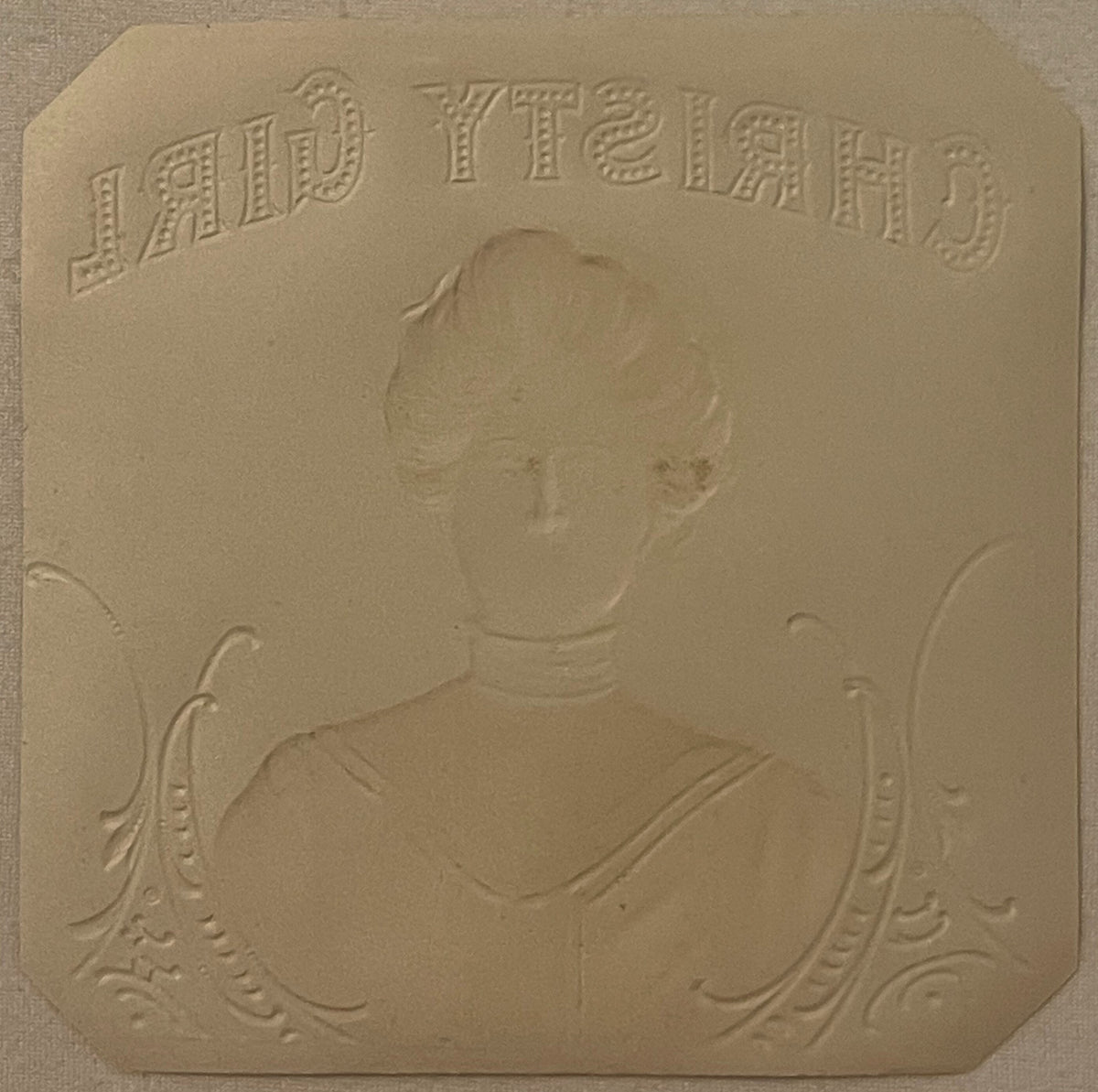 Embossed tan cardstock with "LADY TIEIRGH" text at top and portrait bust of woman in Victorian dress with decorative flourish