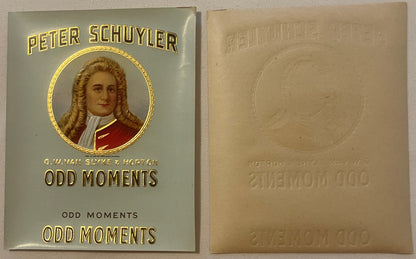 Front and back of embossed cigar box label featuring Peter Schuyler portrait in gold circle, red coat, with "Odd Moments"