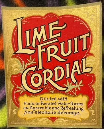 Antique Lime Fruit Cordial label with red heart-shaped design and gold Art Nouveau lettering on cream background