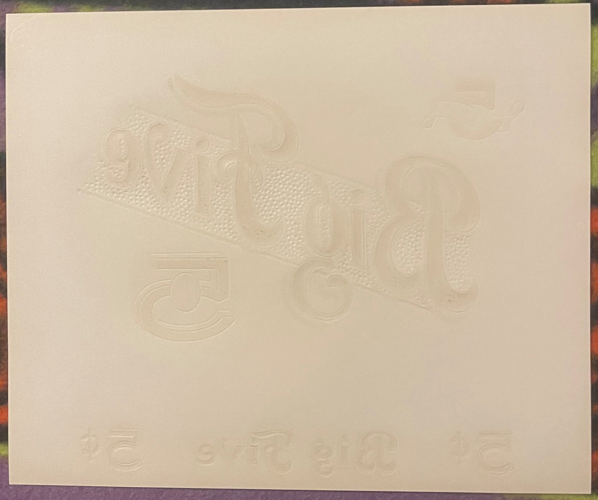 Cream-colored embossed cigar label featuring ornate decorative lettering and dotted texture patterns on aged paper.