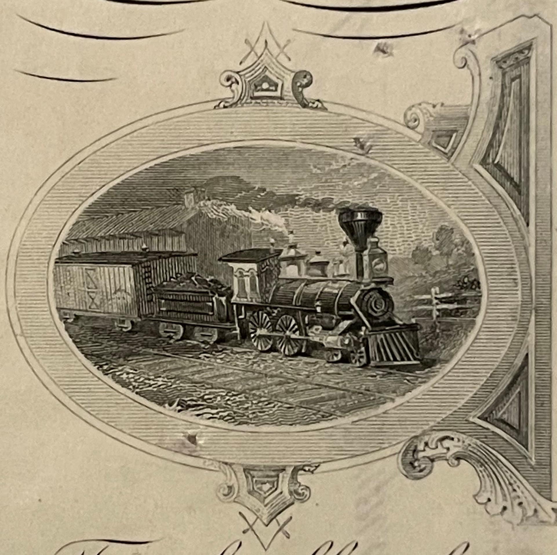 Engraved oval vignette of a steam locomotive with passenger car on railroad tracks, framed by ornate scrollwork borders on ag