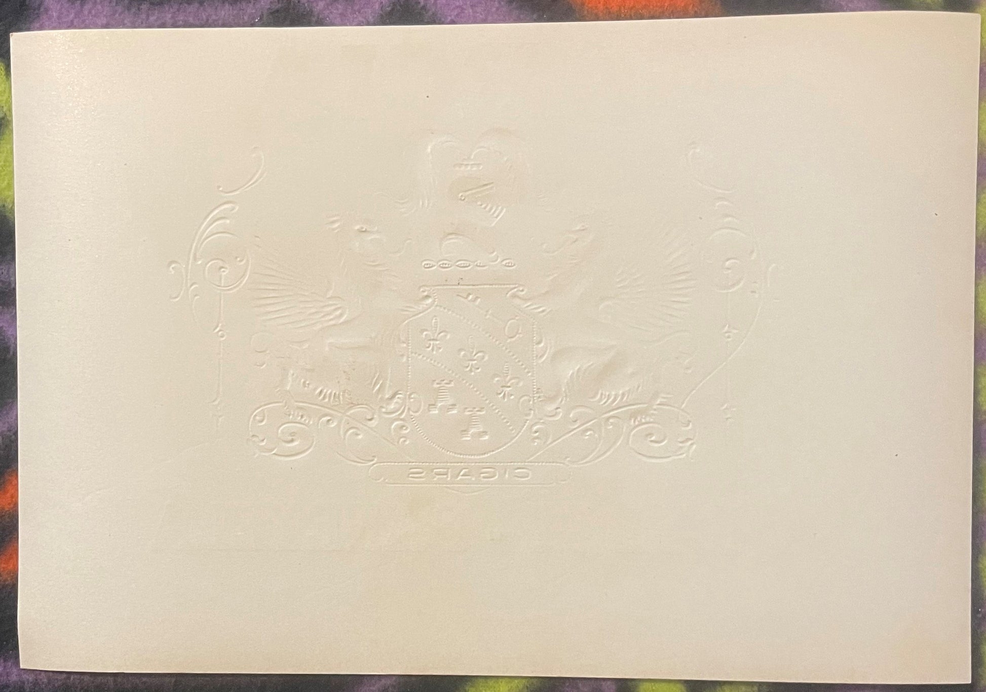 Cream-colored embossed cigar label featuring ornate heraldic design with winged lions and fleur-de-lis shield, Garcia text vi