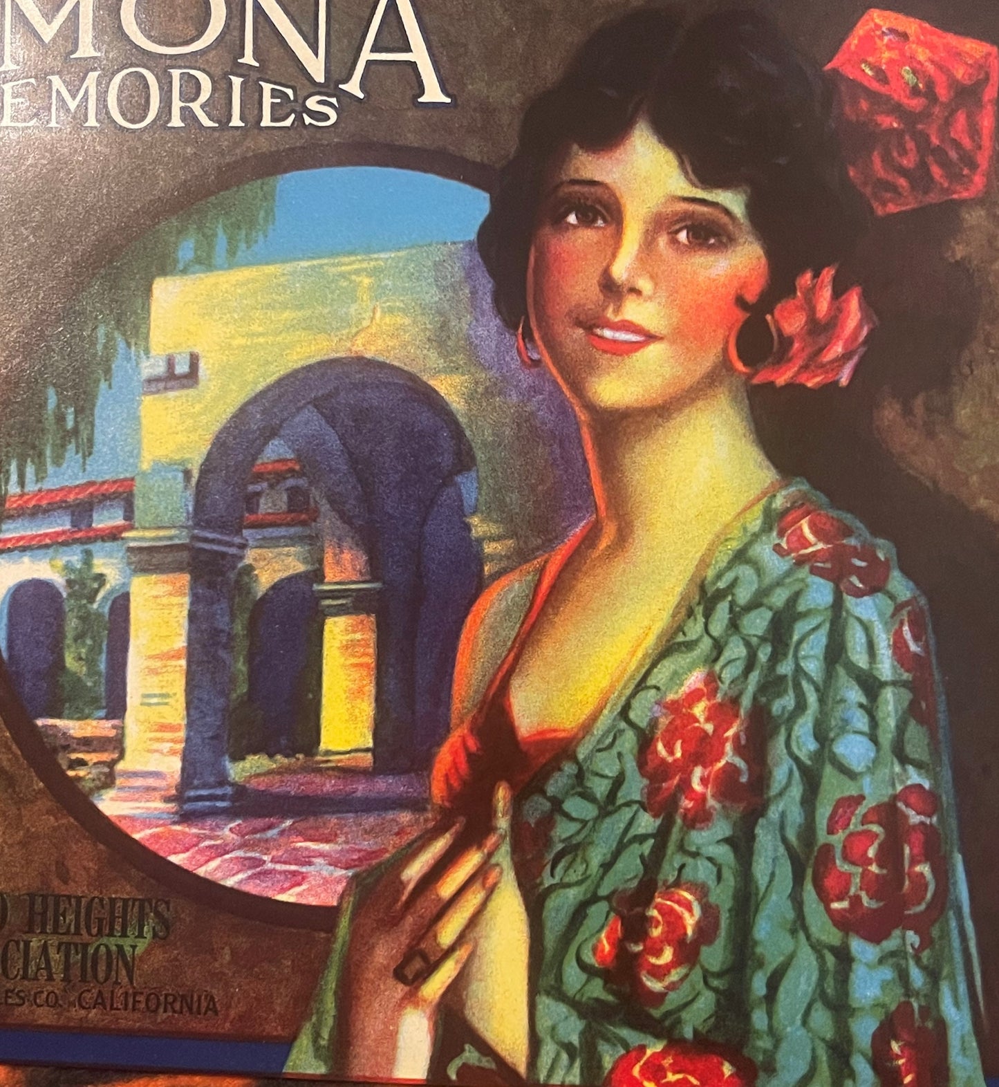 Vintage lemon crate label featuring a woman in a green floral robe with red flowers in her hair, beside an illuminated Medite