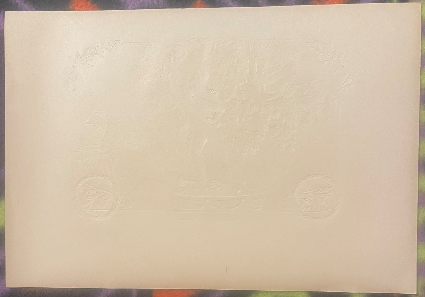 Cream-colored embossed cigar box label with faint neoclassical statuary and decorative motifs visible in relief against plain