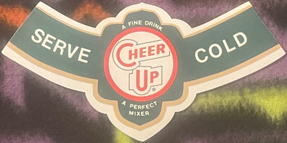 Vintage Cheer Up soda bottle neck label with red and cream logo on green background, reads "Serve Cold" and "A Fine Drink A P