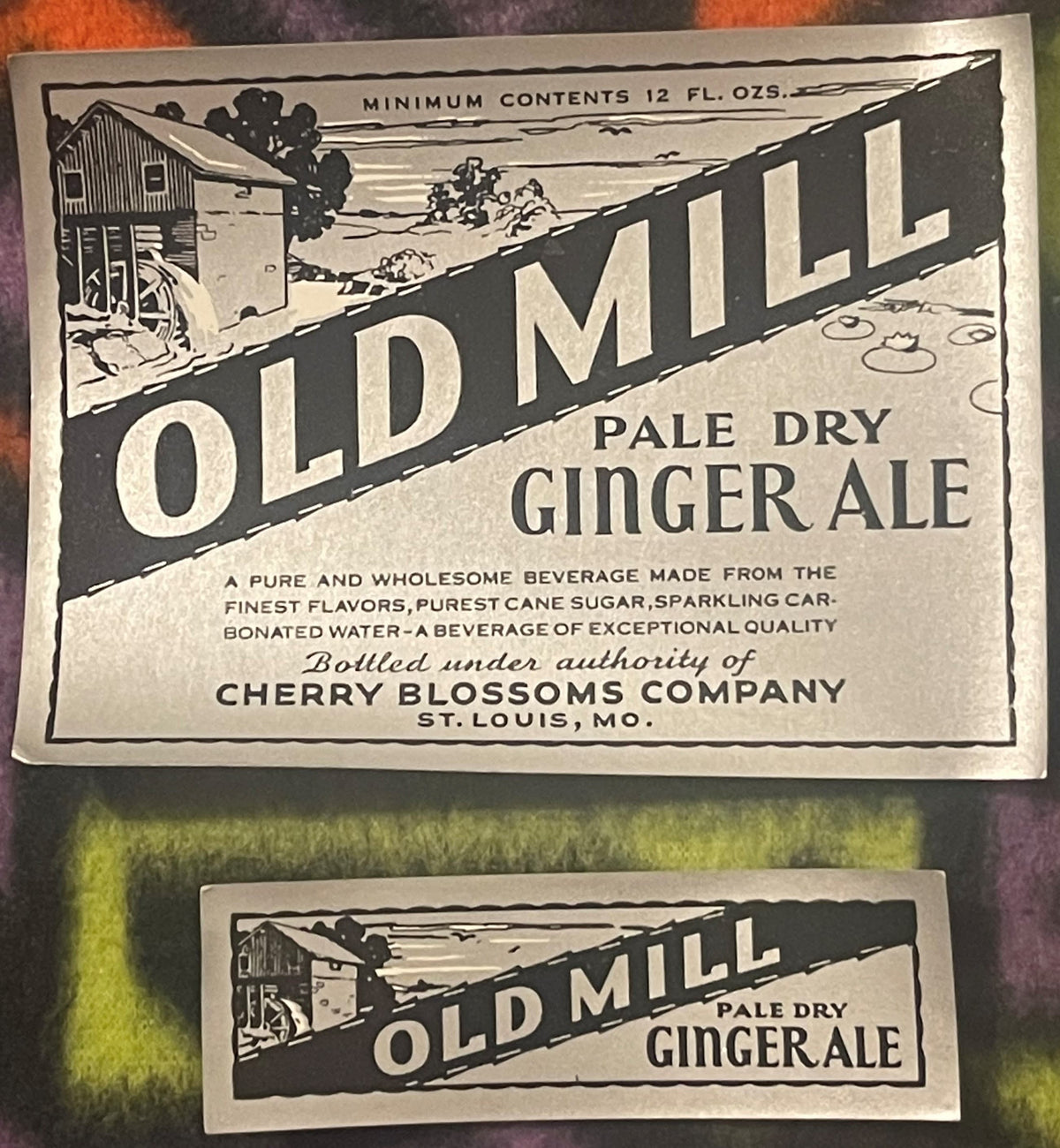 Two vintage Old Mill Pale Dry Ginger Ale labels from Cherry Blossoms Company, St. Louis MO, featuring rural mill imagery in b