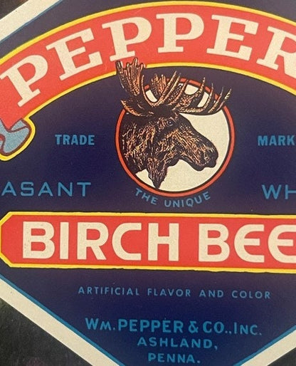 Vintage Pepper's Birch Beer bottle label with moose head illustration, red and navy blue design, Wm. Pepper & Co. Ashland PA 