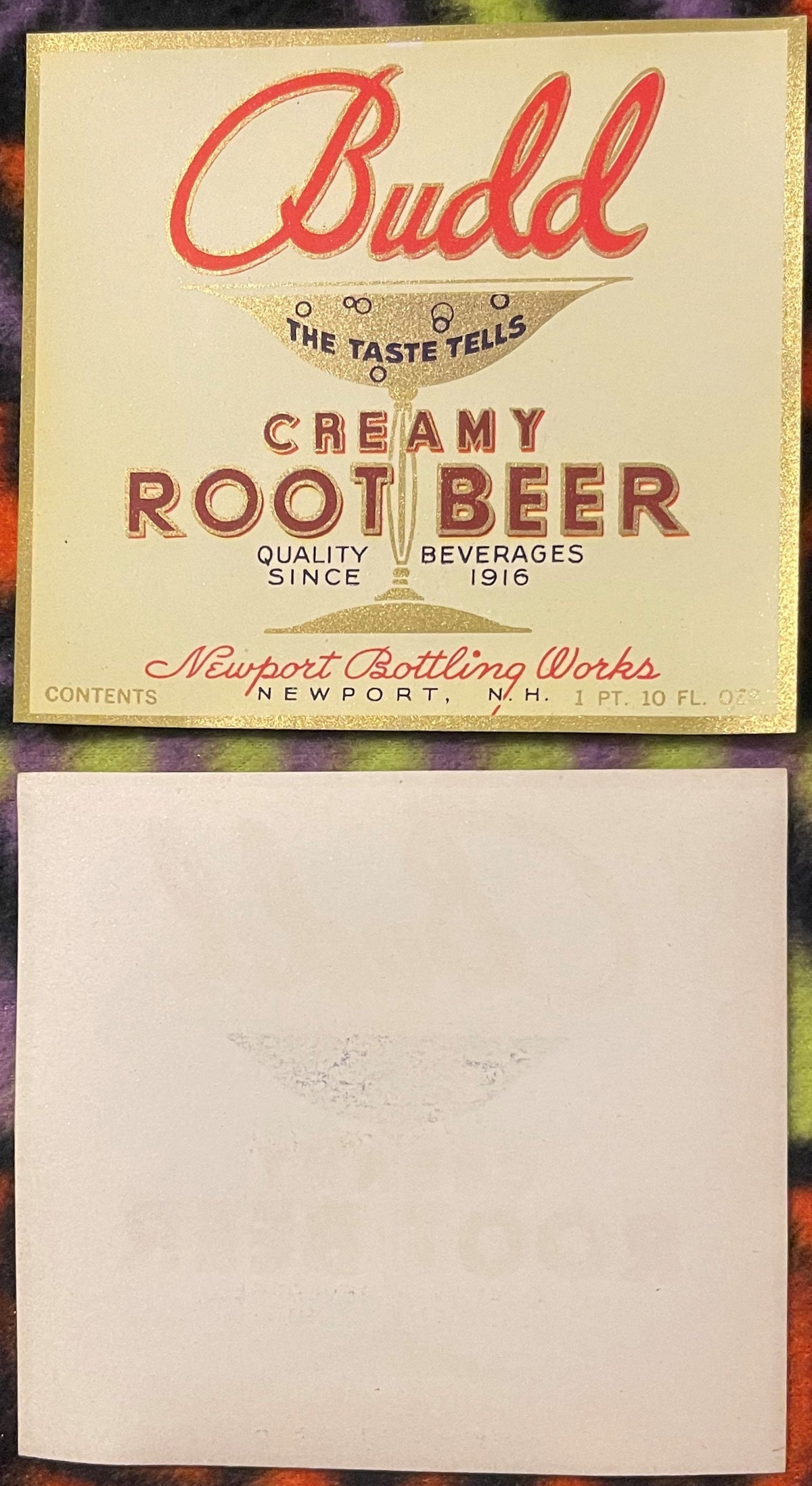 Vintage Budd Creamy Root Beer label with red script text, gold glitter border, and glass illustration, front and back shown