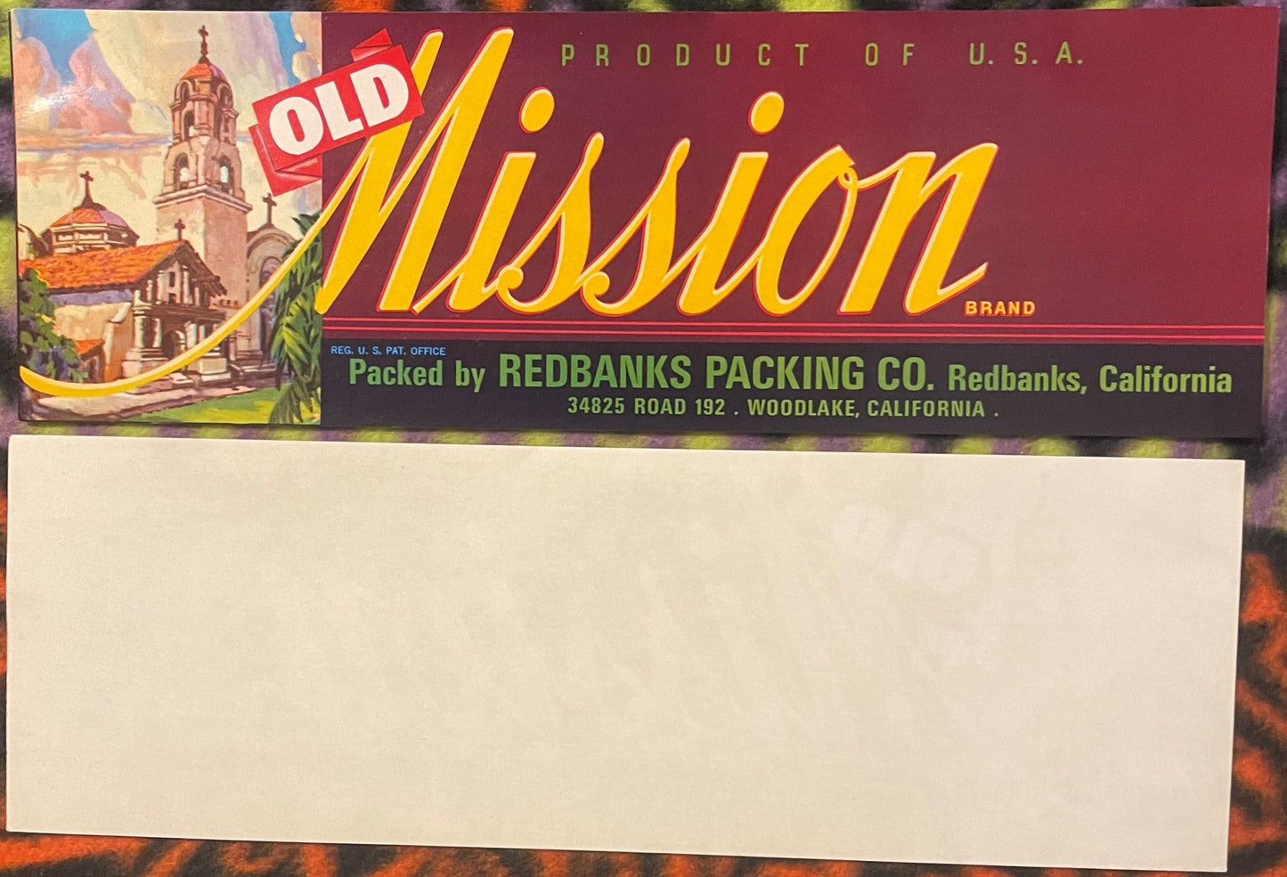 Vintage Old Mission citrus crate label with "SOLD" stamp, featuring Spanish mission architecture and yellow script text on ma