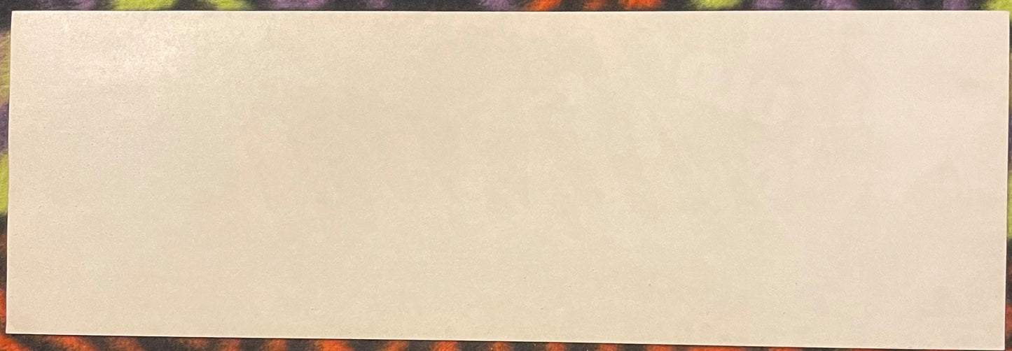 Blank cream-colored vintage citrus crate label on colorful patterned background