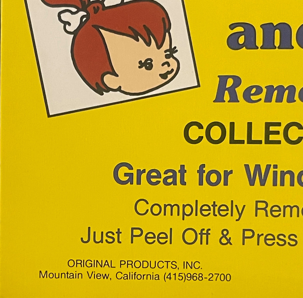 Vintage yellow vending display sign with cartoon character illustration and text "Great for Windows," "Completely Removable,"