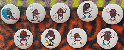 Nine vintage California Raisins pinback buttons arranged on a colorful striped fabric background, each featuring anthropomorp