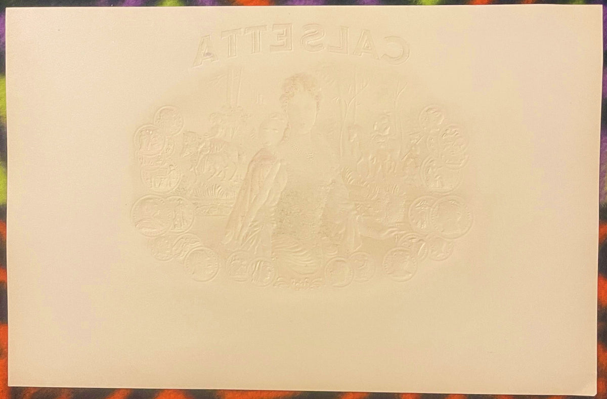 Cream-colored embossed cigar label with "Calsetta" text at top and ornate Victorian royal coat of arms design in center relie