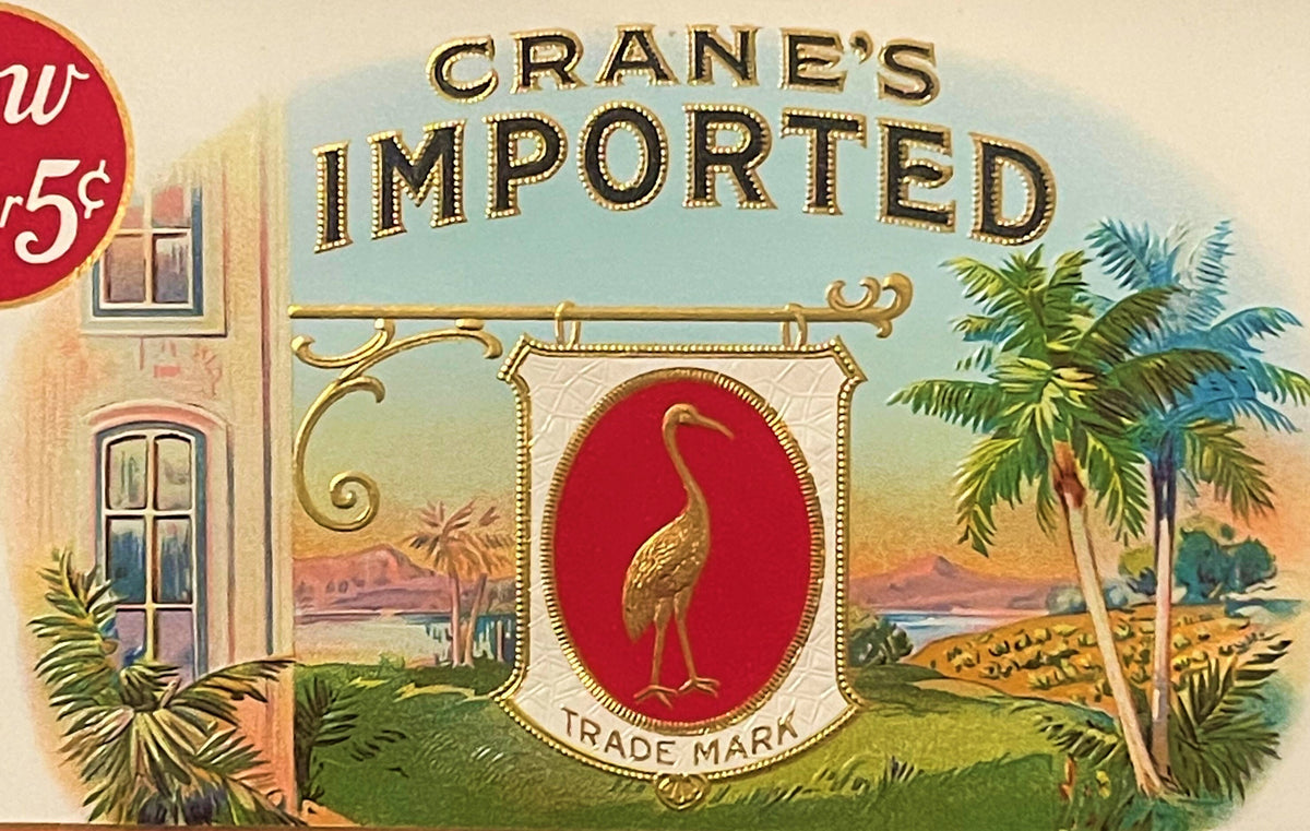 Vintage Crane's Imported cigar band featuring gold-embossed text, a golden crane on red background, tropical landscape, and 5