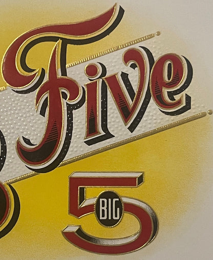 Close-up of embossed cigar label with "Big Five" in red and gold lettering on yellow background, ornate vintage design with b