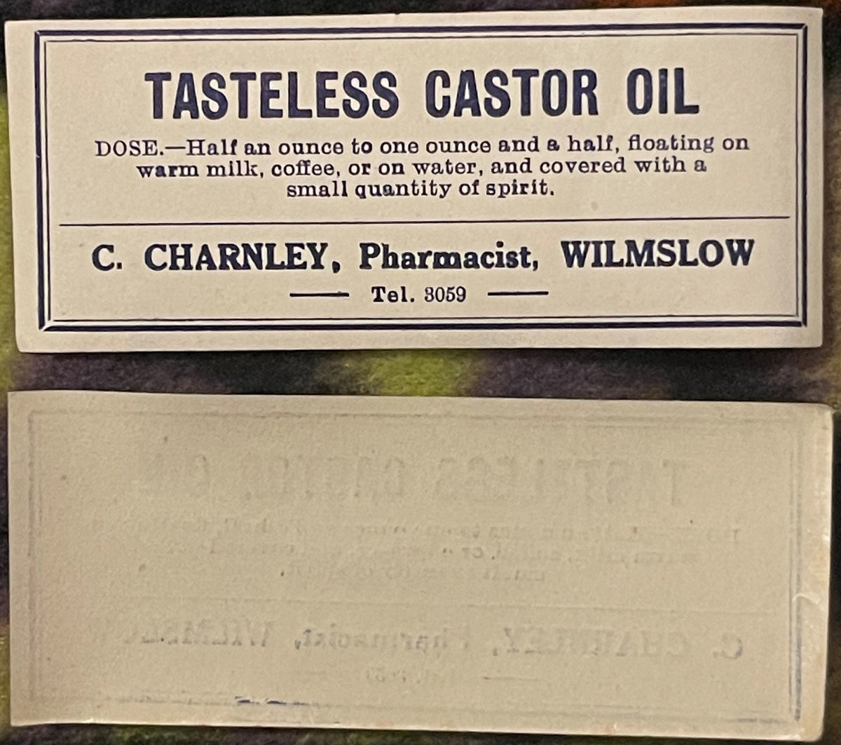Vintage pharmacy label for Tasteless Castor Oil from C. Charnley, Pharmacist, Wilmslow, with dosage instructions
