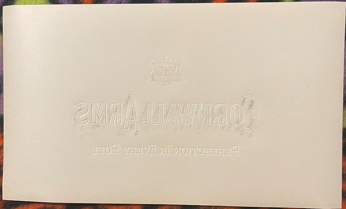 Blank cream reverse of the woodgrain Cornwall Arms label, blind-embossed with the mirrored HL Philadelphia shield and the CORNWALL ARMS / PERFECTION IN EVERY PUFF lettering.
