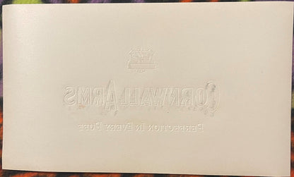Blank cream reverse of the woodgrain Cornwall Arms label, blind-embossed with the mirrored HL Philadelphia shield and the CORNWALL ARMS / PERFECTION IN EVERY PUFF lettering.