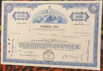 Vintage Unimed Inc stock certificate with blue decorative border, 100 shares, Delaware inc