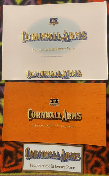 Three Cornwall Arms cigar labels stacked: a cream sheet, an orange wood-grain sheet, and a small label, each with gold-embossed lettering and the HL Philadelphia shield