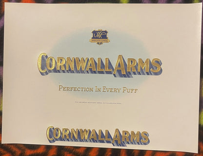 The whole large Cornwall Arms label: HL shield, CORNWALL ARMS, PERFECTION IN EVERY PUFF, the Harold Levy registration line and a second CORNWALL ARMS across the bottom.