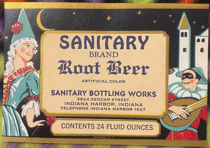Vintage root beer label with gold border featuring illustrated jester and castle, text reading "Sanitary Brand Root Beer"