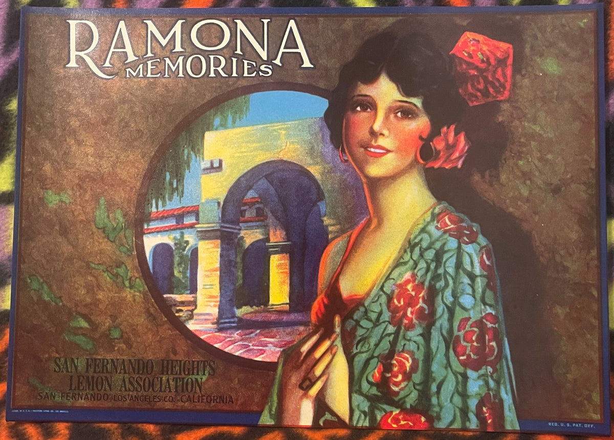 Vintage lemon crate label with Art Deco woman in embroidered robe, Mediterranean archway scene, and "Ramona Memories" text on