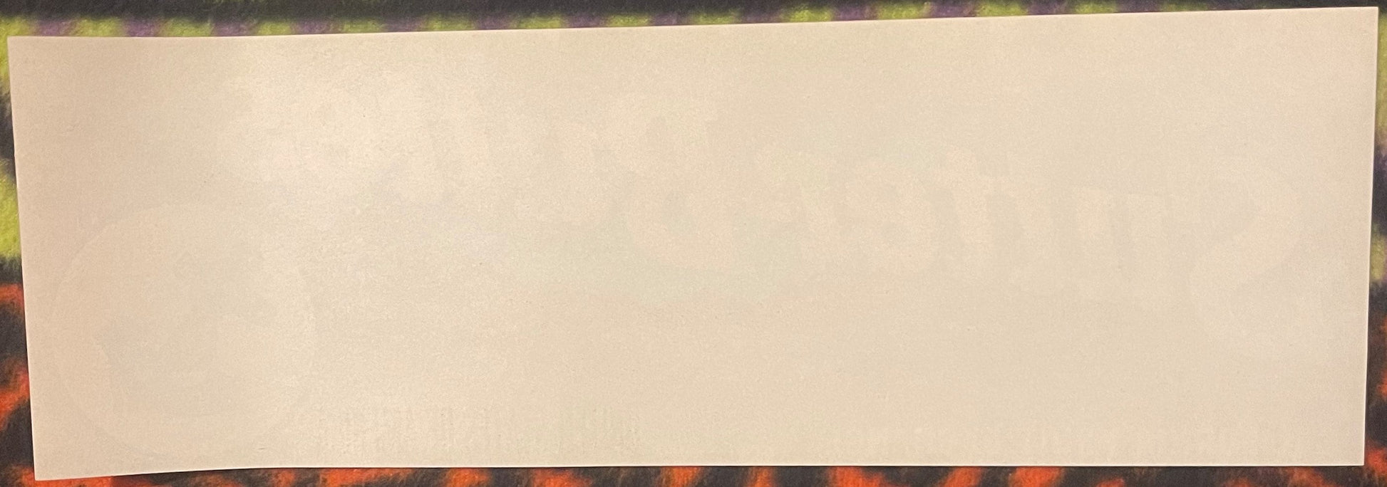 Blank cream-colored vintage crate label on patterned background, front view showing full rectangular label face