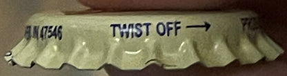 Vintage cream soda bottle cap showing "TWIST OFF" text and product code, scalloped metal edges on cream-colored background