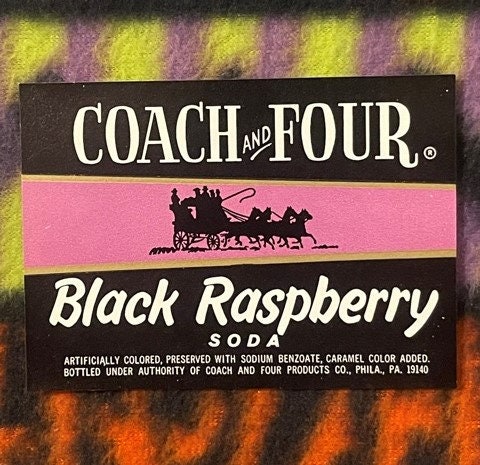 Vintage Coach and Four Black Raspberry Soda label with pink and black design, horse-drawn coach silhouette, Philadelphia addr