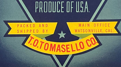 Vintage produce crate label with yellow banners on dark blue background reading "Packed and Shipped by T.O. Tomasello Co" and