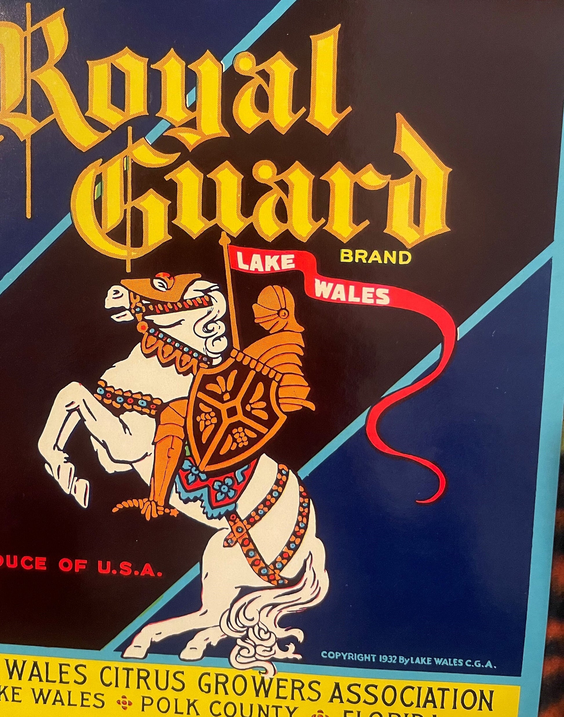 Vintage Royal Guard citrus crate label featuring an ornate white horse with orange decorative saddle and tack on dark blue ba
