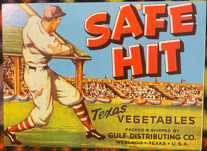 Vintage "Safe Hit" baseball crate label with illustration of batter at stadium, red text on blue sky, yellow-green field, pri