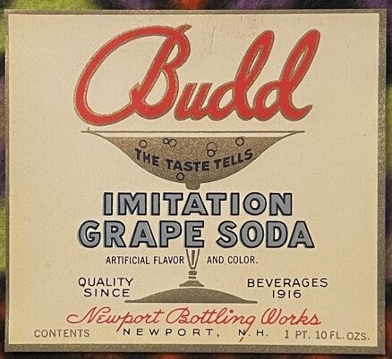 Vintage Budd Imitation Grape Soda label with red script text and Art Deco design from Newport Bottling Works, showing content