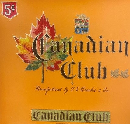 Vintage Canadian Club cigar label with red maple leaf design, ornate typography, and 5¢ price mark on orange background
