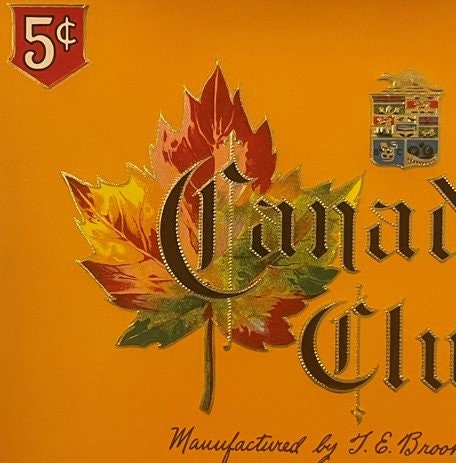 Antique cigar label with red and gold maple leaf, "Canadian Club" text, orange background, 5¢ price mark upper left, manufact