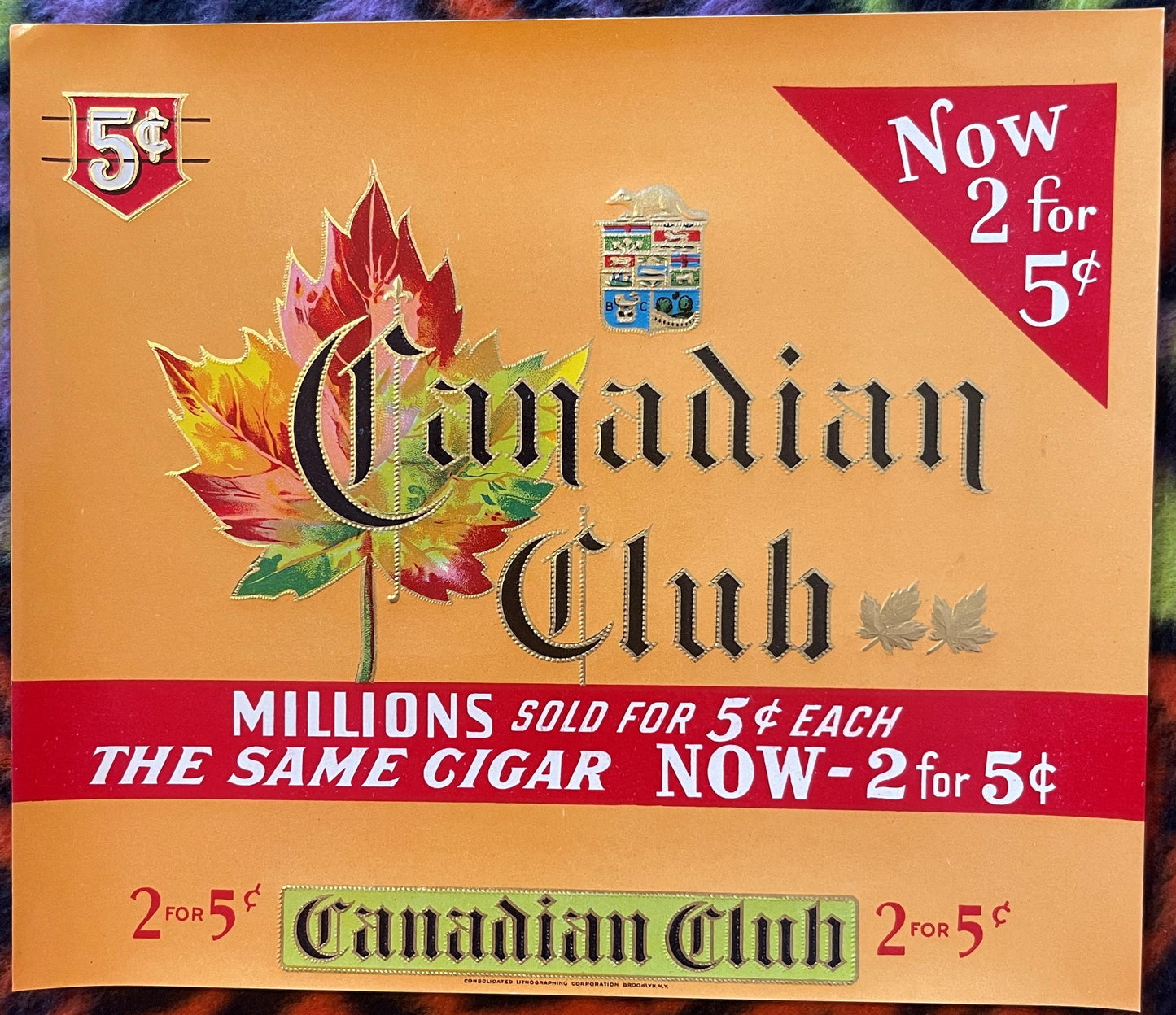 Vintage cigar label with ornate maple leaf design, Canadian Club branding, orange background, red banner stating "2 for 5¢" p