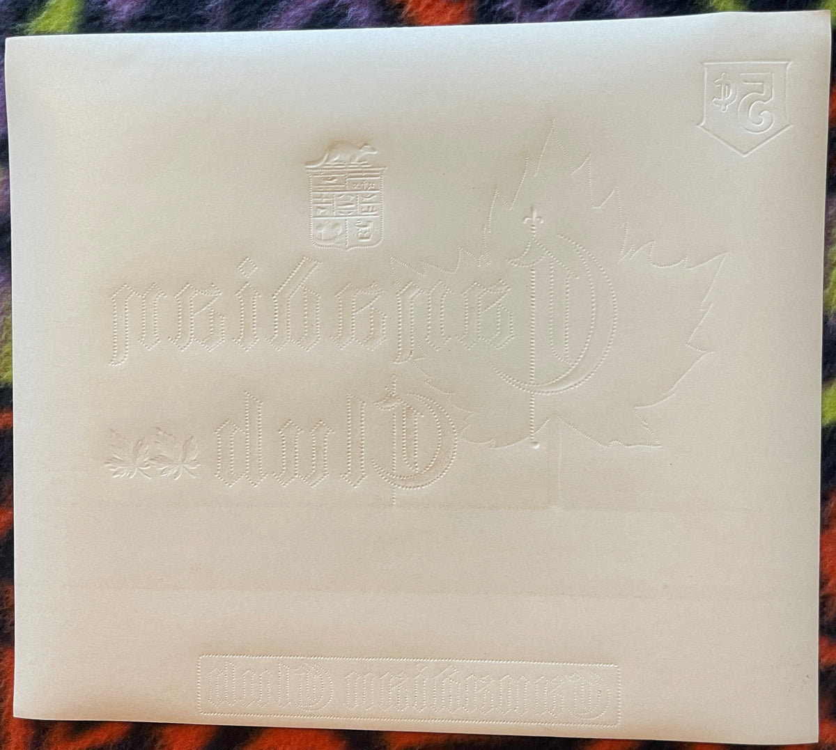 Cream-colored embossed cigar label with "Canadian Club" text, maple leaf design, and coat of arms, displayed flat against col