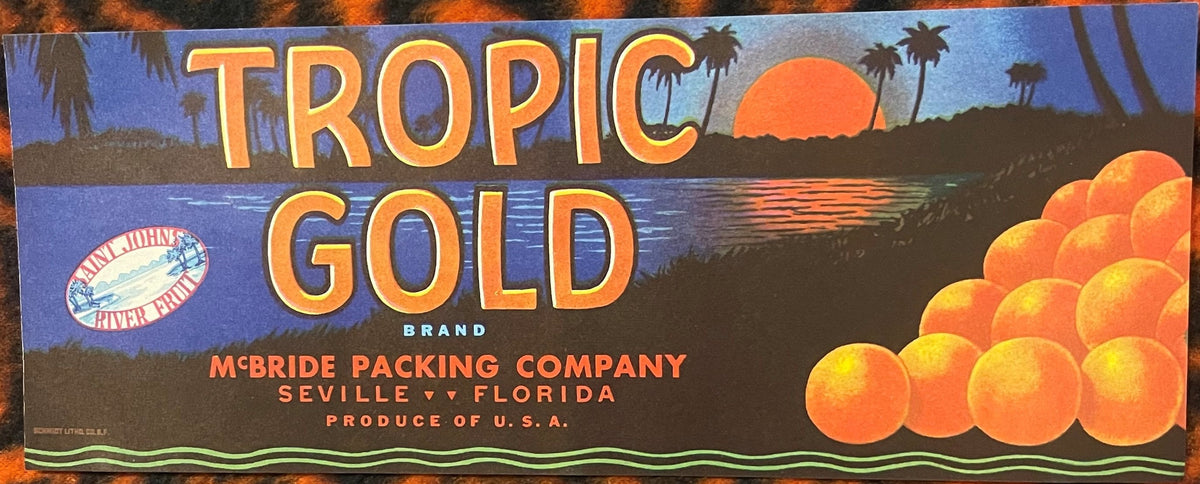 Antique citrus crate label for Tropic Gold brand oranges from McBride Packing Company, Seville Florida, featuring golden oranges, palm trees, sunset, and Saint Johns River logo.